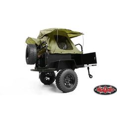 an off - road vehicle with a tent on the back is shown in front of a white background