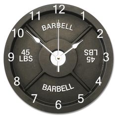 a wall clock with the words barrel on it's face and numbers in white