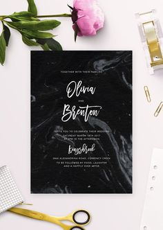 a black and white marbled wedding card with the words elora and boston printed on it