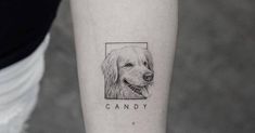 a dog's face is shown on the right forearm and behind it is a candy bar