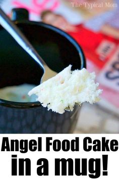 a spoon with some food in it and the words angel food cake in a mug