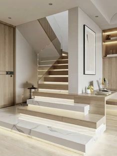 the stairs in this modern home are made of wood