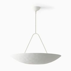 a white bowl hanging from a ceiling light