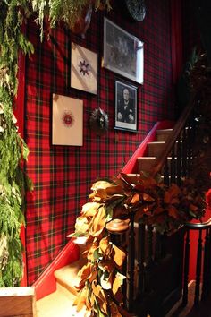 the stairs are decorated with greenery and pictures