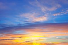 the sun is setting over an ocean with sailboats