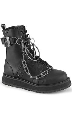 Demonia's Valor boot is a classic combat style. Added chunky chains give them that bad-boy twist. Vegan 1 1/2" (38mm) Platform Lace-Up Ankle Boot Featuring Outer Buckle Strap and Screw Studs, Spike Studs, Various O-Ring, D-Ring & Triangle Rings W/ Hanging Chain Details Inside Metal Zip Closure Rear Zip Closure U.S men's sizing - refer to size chart for more info Spiked Boots Men, Spiked Boots, Boot Chains, Goth Boots, Demonia Shoes, Combat Style, Vegan Leather Boots, Triangle Ring, Black Vegan