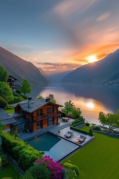 an aerial view of a house with a pool in the foreground and mountains in the background