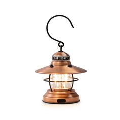 an old fashioned brass lantern with a light on it's side and the word bare bones written on top