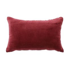 a red velvet pillow on a white background