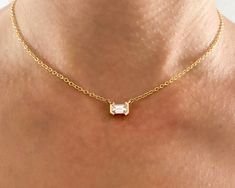 "Minimalist diamond choker. Emerald cut diamond choker made from 14K yellow gold.  A geometric pendant, Available in Different Sizes and also with sapphire. In the photos you can see the pendant with a 0.73 CT, G VS diamond and with a AAA pink sapphire 0.34 CT.  Necklace Description: * Necklace length: 13.8\" / 35 cm. + 1.18\" / 3 cm extension chain. * Materiel: 14K Gold * Pendant height: 0.21\" / 5.5 mm.  * Pendant width: 0.28\" / 7.2 mm. **Pendant measurements are accurate for a 0.70 CT diamon Emerald Cut Diamond Necklace, Diamond Chocker, Gem Tones, Solid Gold Necklace, Diamond Choker, Diamond Solitaire Necklace, Emerald Cut Diamond, Solitaire Necklaces, Vs Diamond