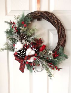 a christmas wreath hanging on the front door