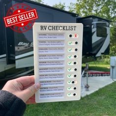 the rv checklist is being held up by someone