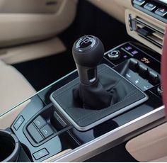 the interior of a modern car with an automatic gear stick and steering wheel knobs