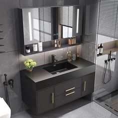 a bathroom with a sink, mirror and shower stall in the middle of it's walls