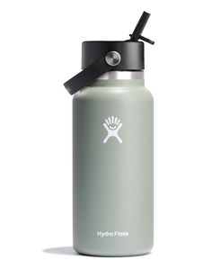 the hydro flask water bottle has a black lid and is in front of a white background