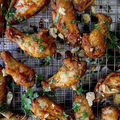 chicken wings with parsley and nuts on a cooling rack