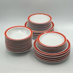 red and white plates stacked on top of each other