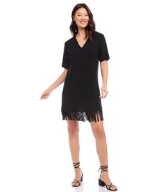 Stand out in this versatile, comfortable dress made from a lush curtain of fringe details with stretch jersey knit. This dress can easily transition from brunch to dinner with a simple switch of shoes and accessories. Short sleeves Length: 37 1/8 inches (size MP) 90% Rayon, 10% Spandex Made in USA Machine wash cold separately V-neckline Fringed hem | Karen Kane Petite Size V-Neck Fringe Dress in Black, Size LP, Plain, Rayon/Spandex Casual V-neck Dress With Fringe, Casual V-neck Fringe Dresses, Casual Short Sleeve Dress With Fringe, Bohemian Chic Outfits, Black Dress Style, Fringe Shirt, Short Dress Styles, Fringe Dress, Karen Kane