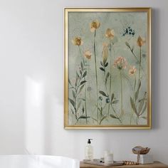 a painting hanging on the wall above a bathtub