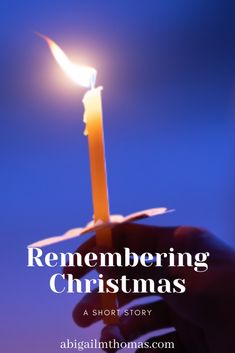 a person holding a candle with the words, remembranceing christmas written on it in front of