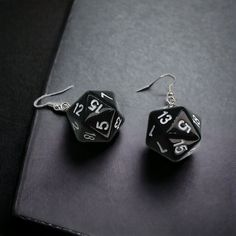 These Eye-Catching Black 20-Sided Dice Earrings Are Perfect For Game Lovers! Handmade With Care, These Earrings Feature Sleek Black Dice With Crisp White Numbers. Measuring 2 X 0.76 Inches, They Make A Bold Statement For Any Outfit. Whether You're Heading To The Casino, Game Night, Or Just Want To Showcase Your Unique Style, These Earrings Are A Must-Have Accessory. - Handmade For A Unique Touch - Sterling Silver Earring Hooks For Comfort - Versatile For Casual Or Special Occasions - Ideal Gift Queer Earrings, Dice Jewelry, 20 Sided Dice, Dice Earrings, Script Writing, Gothic Earrings, Game Lovers, Day Wishes, Gamer Gifts