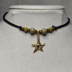 Green Ceramic Beaded Gold Swirl Starfish Charm Boho Hippie Beach Adjustable Black Rope Cord Choker Stacking Necklace Comes On An Adjustable Waxed Black Cord Necklace. Necklace Is Adjustable From Approximately 13" To 22". To Wear Your Necklace Pull The Two Knots Away From The Pendant To Adjust To A Larger Size, Leave About An Inch Of Space Between The Two Knots To Prevent It From Getting Stuck. Put Cord Around Your Neck And Pull The Two Knots In The Opposite Direction To Adjust To A Smaller Size. Adjustable Star-shaped Bohemian Jewelry, Adjustable Bohemian Star Jewelry, Adjustable Star Charm Festival Jewelry, Handmade Adjustable Star Necklace, Adjustable Star Charm Jewelry For Festivals, Bohemian Star Shaped Beaded Necklaces For Gifts, Handmade Starfish Beaded Necklaces As Gift, Star-shaped Colorful Beaded Jewelry For The Beach, Casual Star Charm Jewelry Gift