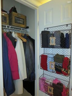 the closet is organized with clothes and other items