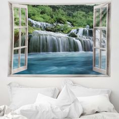 an open window shows a waterfall in the background and water flowing from it's side