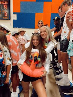 two girls are holding an inflatable life preserver