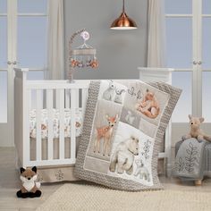 a baby crib with two stuffed animals next to it and a teddy bear on the floor