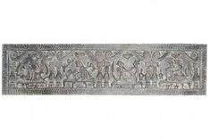 an old metal plaque with people and animals on it