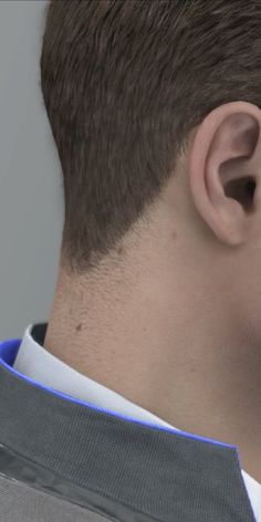 a close up view of a man's face and ear