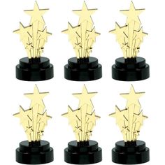 six gold stars on black pedestals with white background