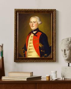 a portrait of george washington hangs on the wall next to a busturine and books