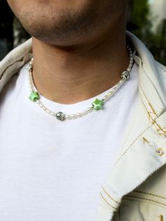 ON ME: - Total strand length is 16" All sizes: 16 inch - 41 cm 18 inch - 46 cm 20 inch - 51 cm 22 inch - 56 cm Elevate your style with our Men's Pearl Necklace featuring ceramic beads and a star green choker. Crafted with freshwater pearl, this pearl choker is perfect for any occasion. This beaded necklace stands out as a star pearl necklace, offering a touch of elegance with dainty pearl accents. Ideal for those seeking a pearl necklace that is both sophisticated and unique. Designed as a uniqu Pearl Necklace Boy, Mens Pearl Necklace, Boy Necklace, Green Choker, Star Pearl, Necklace Ceramic, Boys Necklace, Classic Pearl Necklace, Real Pearl Necklace