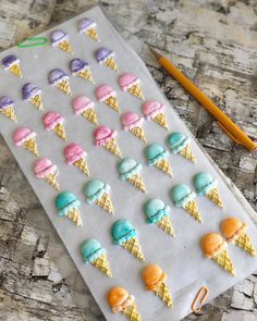 an ice cream tray with different flavors of ice cream on it and a pencil next to it