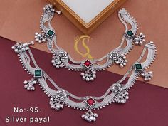 Description :- Bridal Wear Anklet | Payal | Indian Jewellery | Well Made | Wedding Gift Silver Payal/ Panjeb/ Pakistani Jewelry/ Bollywood Jewelry Gift yourself a royal look with this perfectly crafted payal from Manalisstudio. Crafted with high quality Silver Plated, it is impressive in design. The green enamel artwork adds perfect texture to the design. Perfect for weddings and festivities, this antique necklace set should be put on with your favorite sari or lehenga. 100% Satisfaction. Long L Payal Indian, Antique Silver Anklet, Payal Designs Silver, Antique Necklace Set, Silver Anklets Designs, Silver Payal, Anklets Indian, Bridal Anklet, Bridal Jewelry Vintage