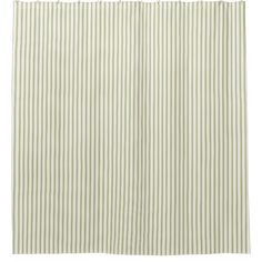 a green and white shower curtain with vertical stripes on the bottom, in front of a white background