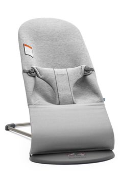 a grey baby seat with an orange tag on it's arm and back end