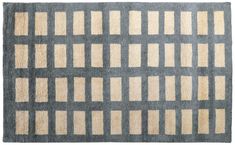 a gray and beige rug with squares on the bottom, in different shades of grey