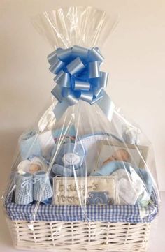 a white basket filled with baby items on top of a table