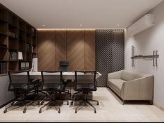 an office with a couch, desk and bookshelf in it's center