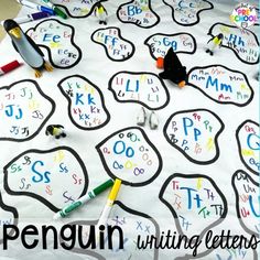 a table covered with writing letters and penguins