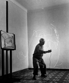 a man standing in front of a whiteboard drawing