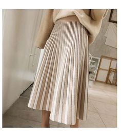 Mid Calf Solid Elastic Knitted Skirt – Tomscloth Casual Beige Ribbed Skirt, Casual White Skirt For Winter, Trendy Long Skirt For Winter, Knit Mini Skirt For Spring, Spring Knit Mini Skirt, White Stretch Skirt For Winter, Winter Long Non-stretch Pleated Skirt, Elegant Beige Knit Skirt, White Pleated Skirt For Winter