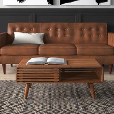 a living room with two brown couches and a coffee table in front of them