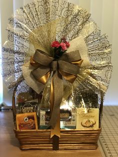 a gift basket with flowers and chocolates in it