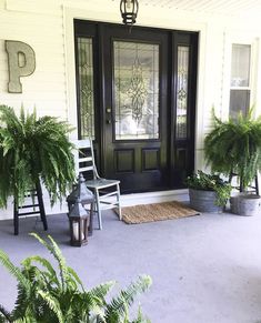 the front porch is clean and ready to be used as a place for potted plants