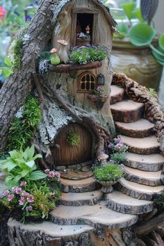 a tree stump house with steps leading up to it and plants growing on the side