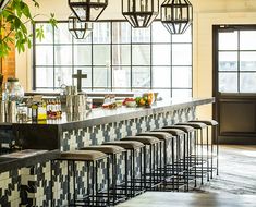 a bar with several stools in front of it